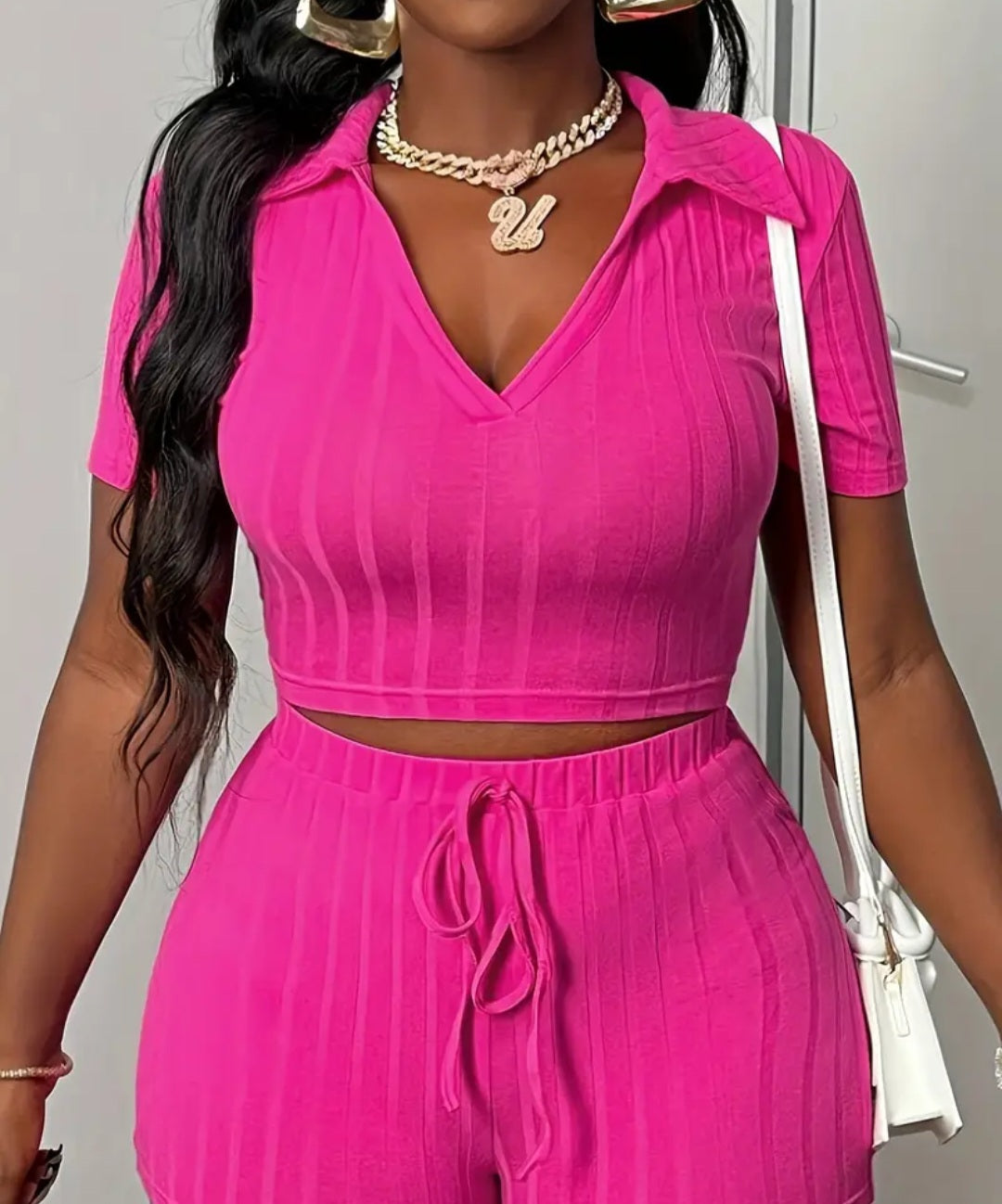 Women's Stretchy V-Neck Bodysuit Set in vibrant pink color, featuring a cropped top with short sleeves and a stylish collar, paired with high-waisted matching pants. Perfect for casual wear with a chic look.