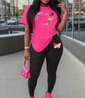2Pcs Casual Heart & Butterfly Print Outfit for Kids featuring a vibrant pink round neck T-shirt with heart and butterfly designs paired with black long pants, ideal for playful outings.