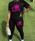 Queen Crown Women's Activewear Set featuring a stylish black stretchy polyester tee with a pink crown and 'Queen' graphic, matched with black long pants, perfect for workouts or casual outings.
