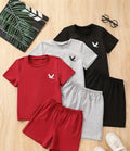 Boys 6-Piece Eagle Graphic Print T-Shirt and Shorts Set laid out on a wooden surface, featuring colorful short-sleeve T-shirts in red, gray, and black, along with matching shorts, perfect for casual summer wear.