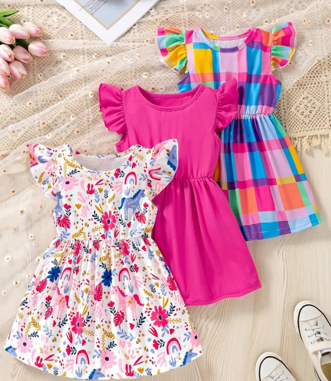 Girls' 3-Piece Casual Dress Set featuring vibrant striped and floral prints, showing a colorful collection of dresses perfect for playtime fun.