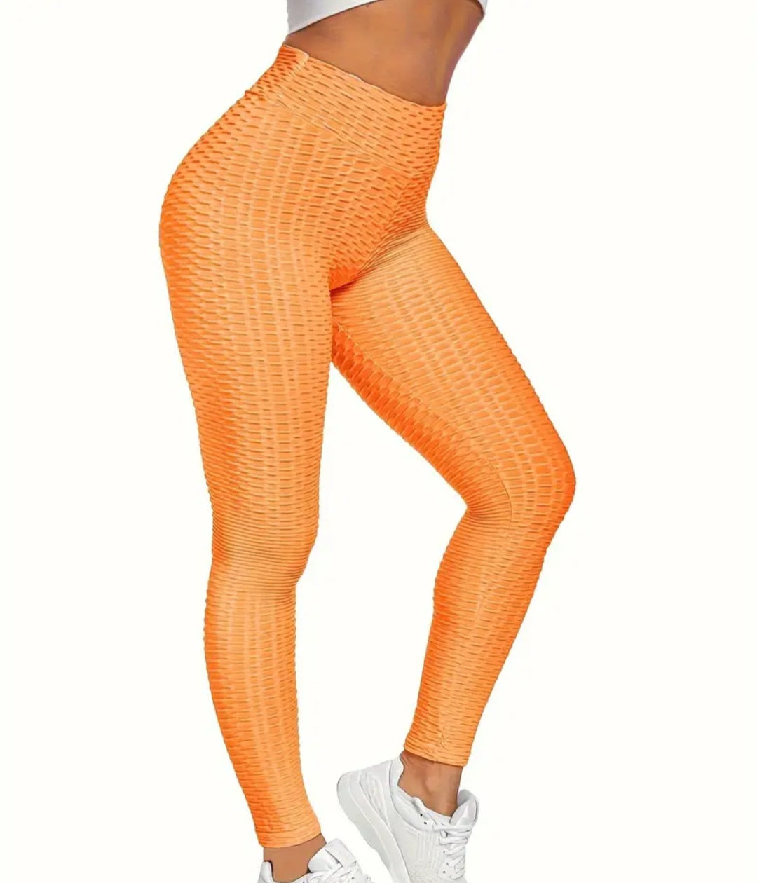Women's Solid Color Slimming Butt Lifting Yoga Pants - Honeycomb Activewear Leggings in vibrant orange, featuring a body-hugging fit for a stylish workout.