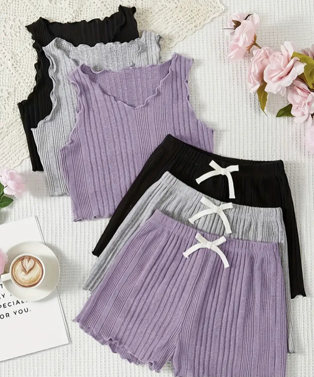 Girls 3-Piece Summer Vest and Shorts Leisure Set featuring stylish ribbed vests in purple, grey, and black, paired with matching lightweight shorts. Perfect for summer adventures and comfortable play.