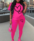 Stylish Women's 2-Piece Heart Print Casual Set featuring a vibrant pink short sleeve tee and matching leggings, perfect for casual outings or lounging.