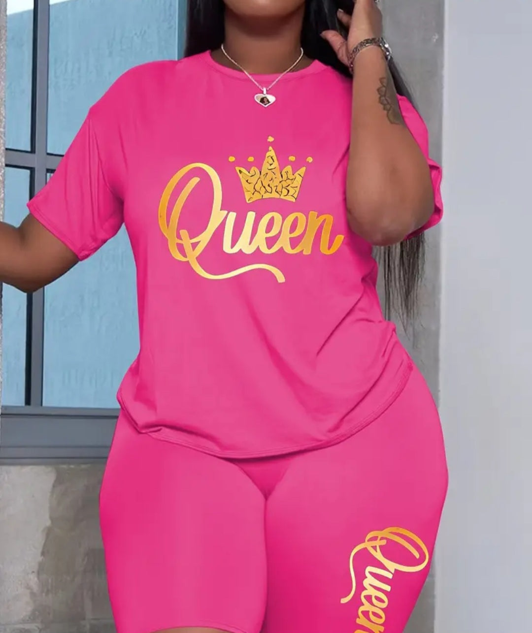 Plus Size Women's Queen Shirt & Shorts Set in bright pink, featuring stylish gold crown graphic, perfect for casual wear and lounging.