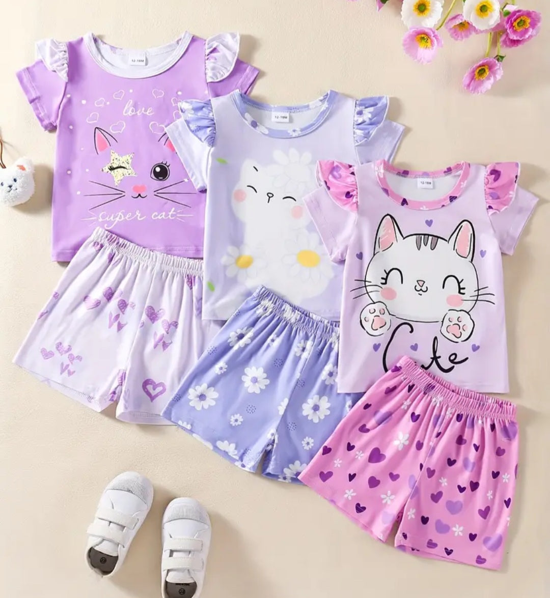 Girls 3-Piece Kitty Cat Set featuring a cute kitty cat graphic tee, soft leggings, and a cozy cardigan. The outfit includes playful designs with a variety of colors perfect for a fashionable and comfortable look.