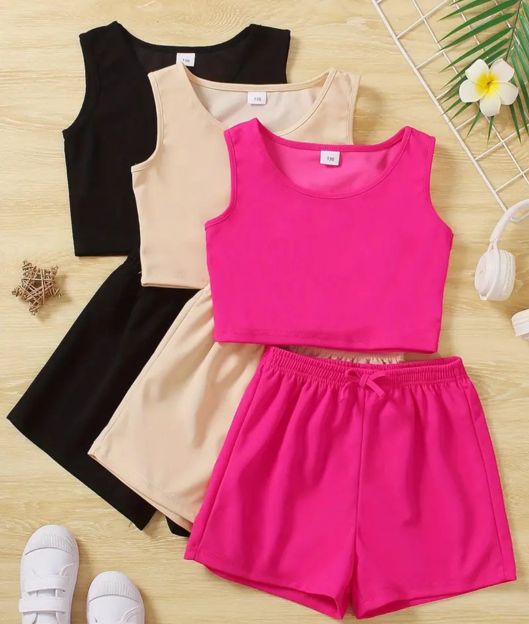 Girls Floral Vest and Shorts Set featuring a stylish soft cotton design in vibrant colors, perfect for ages 2-8. Includes a pink vest and matching shorts with comfortable fit for summer fun.